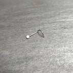 20G 1/4 White Synth Opal G23 Titanium Threadless Left Nose Screw